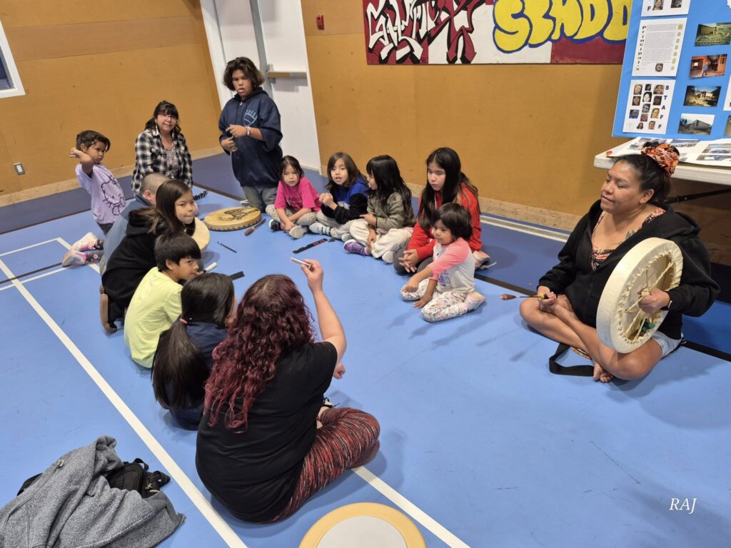 Children and adults participate in a cultural workshop